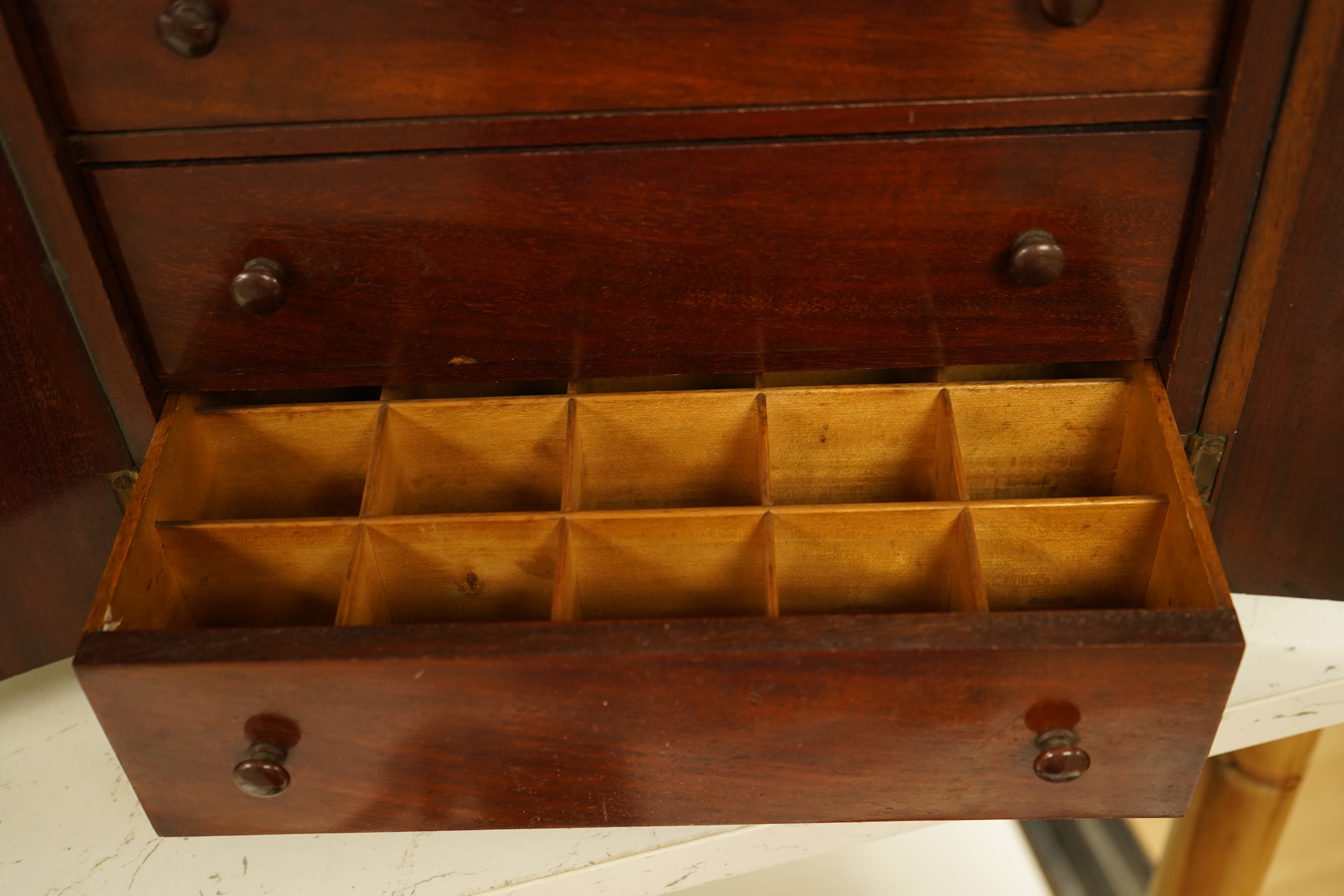 A late 19th century mahogany cabinet fitted with four drawers, 32cm high